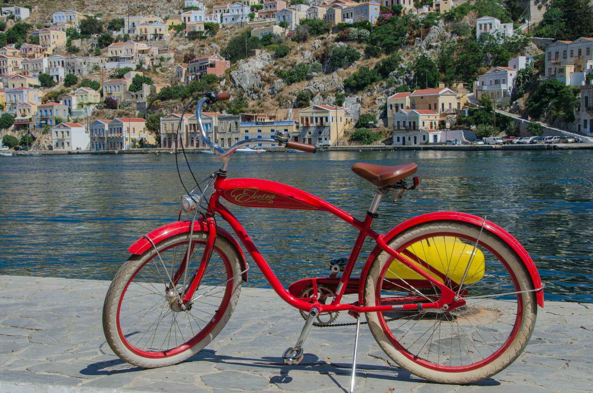 A red bike by the water